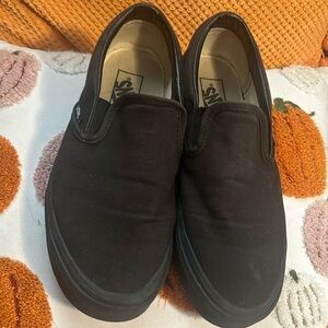 Black slip on vans.